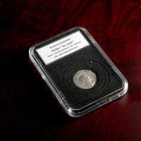 Roman silver antoninianus of Philip I in protective slab with catalog label.