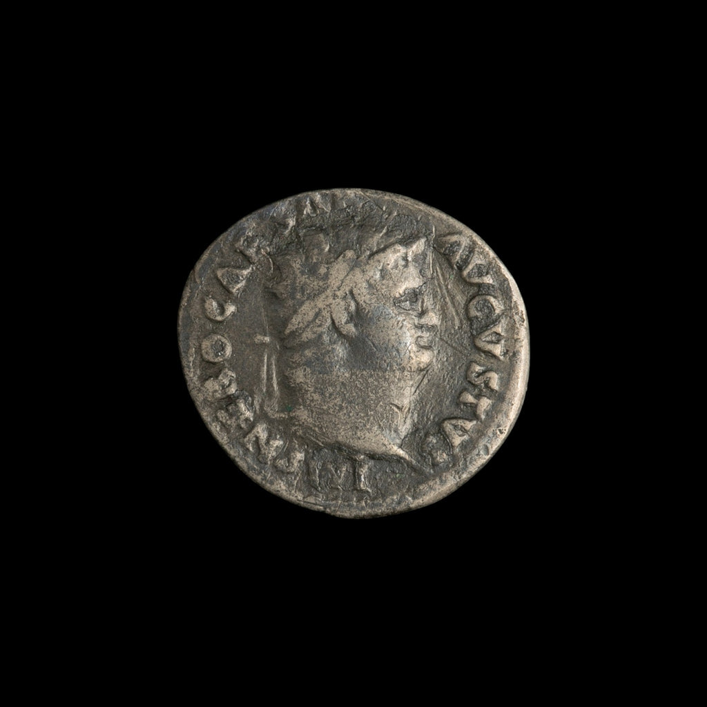 Obverse of Roman silver denarius of Nero, legend IMP NERO CAESAR AVGVSTVS, radiate or laureate bust right.
