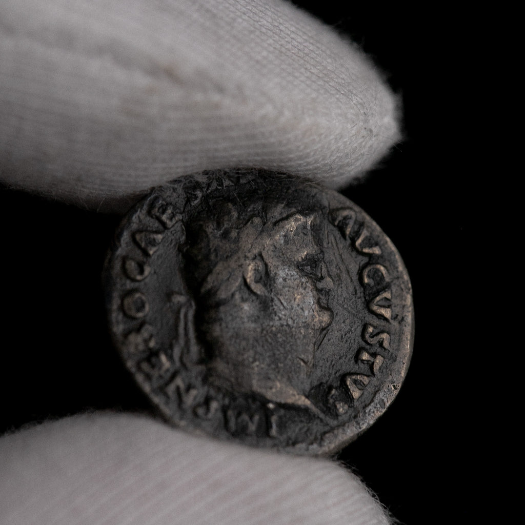 Macro detail of Roman silver denarius of Nero, portrait close-up.