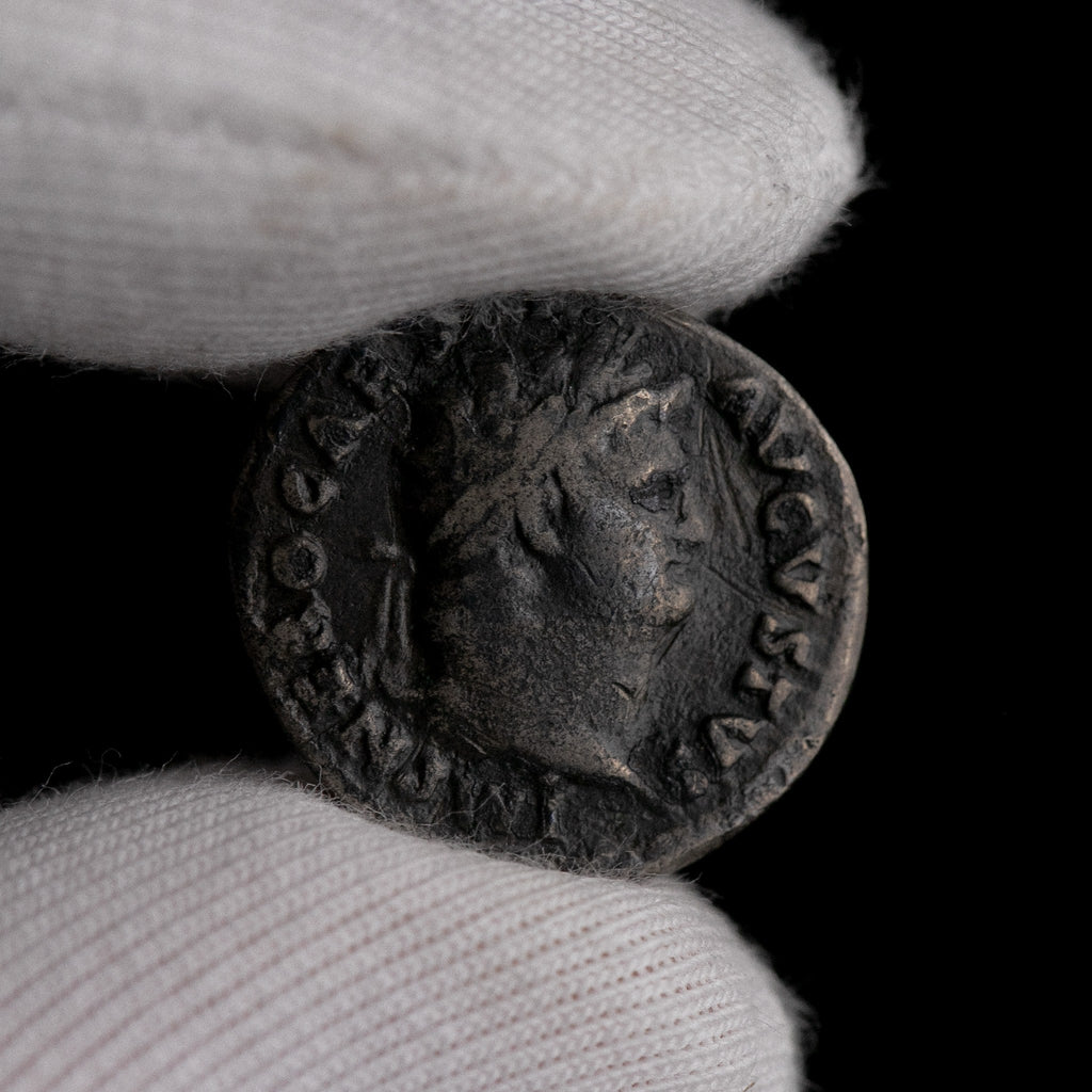 Macro detail of Roman silver denarius of Nero, portrait close-up.