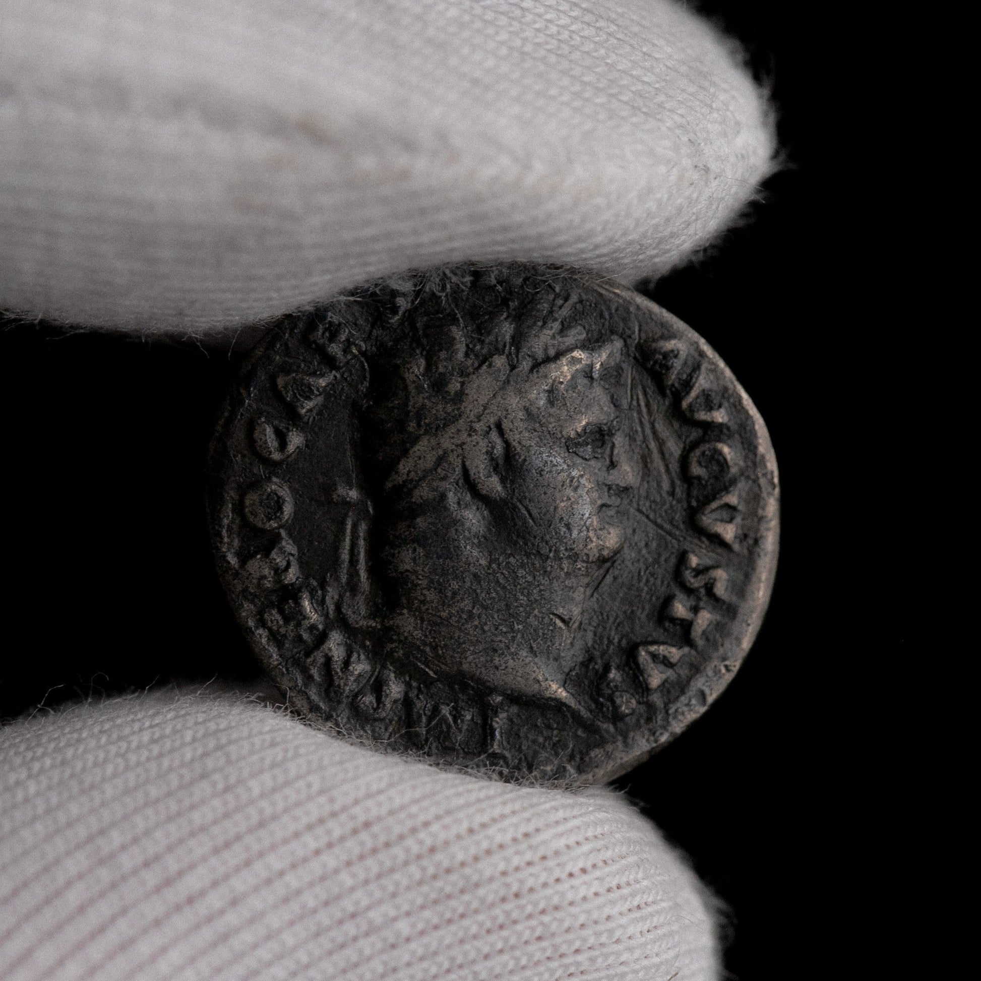 Macro detail of Roman silver denarius of Nero, portrait close-up.