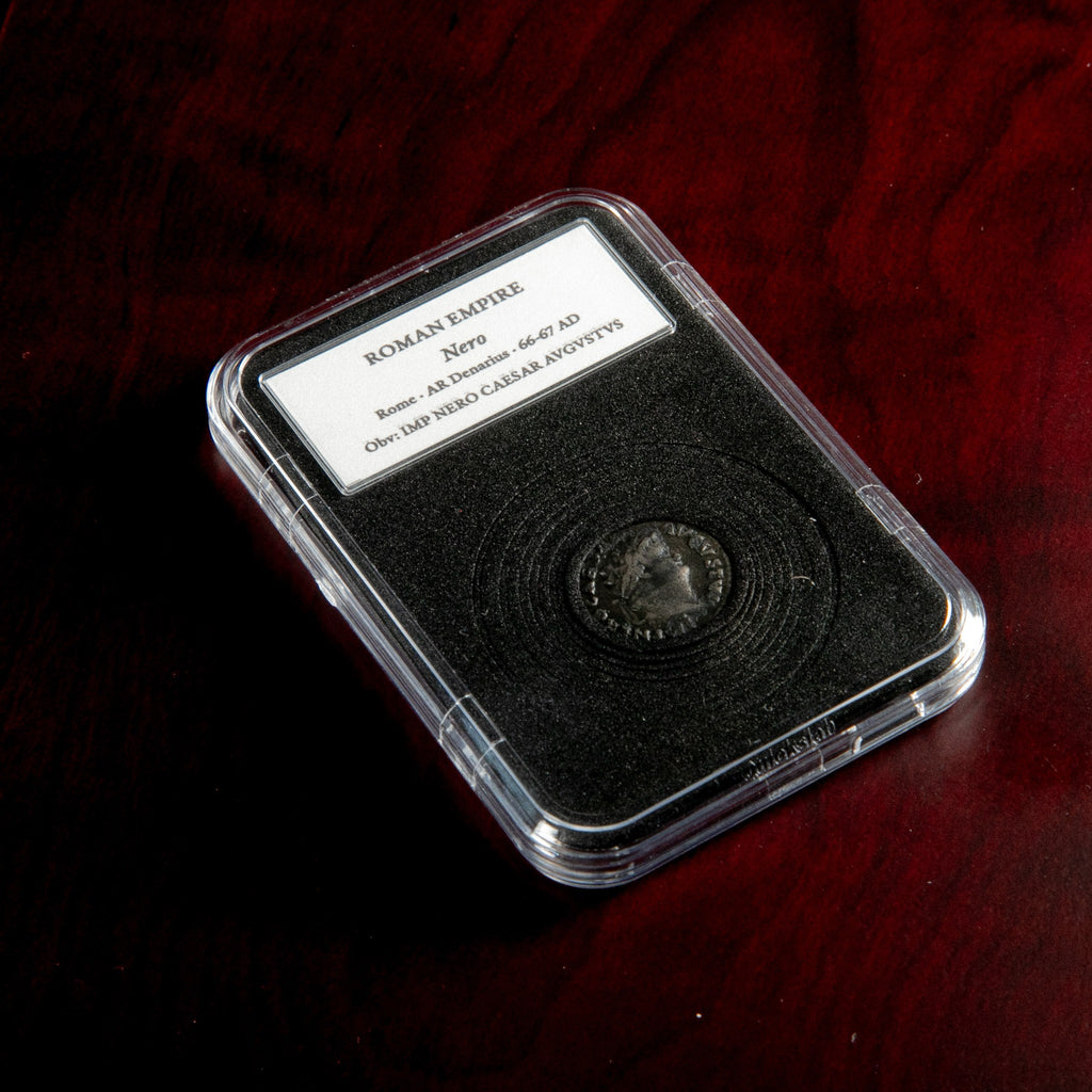 Roman silver denarius of Nero in protective slab with catalog label.