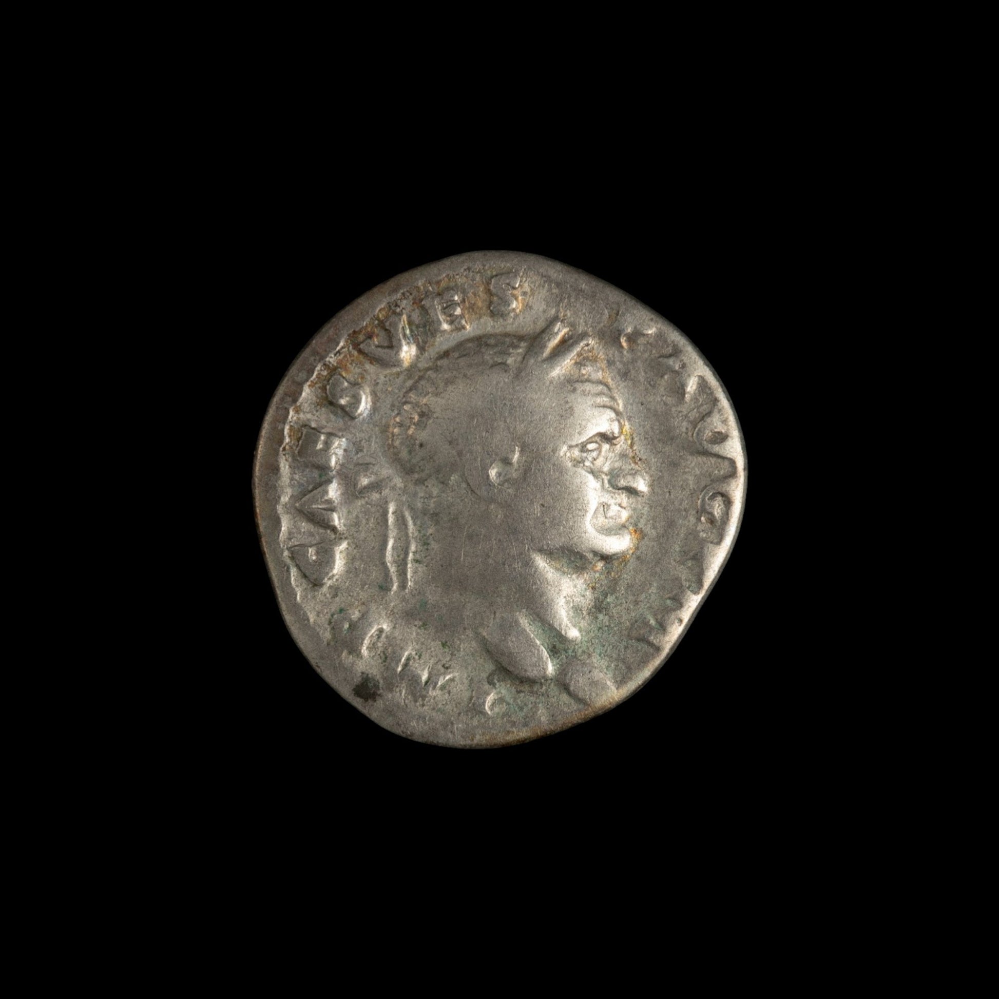 Obverse of Roman silver denarius of Vespasian, legend IMP CAES VESP AVG P M, radiate or laureate bust right.