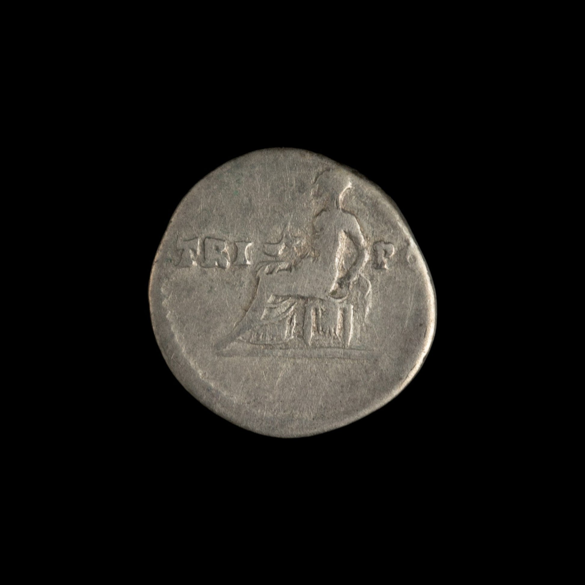 Reverse of Roman silver denarius of Vespasian, showing Vesta seated left, legend TRI-POT.