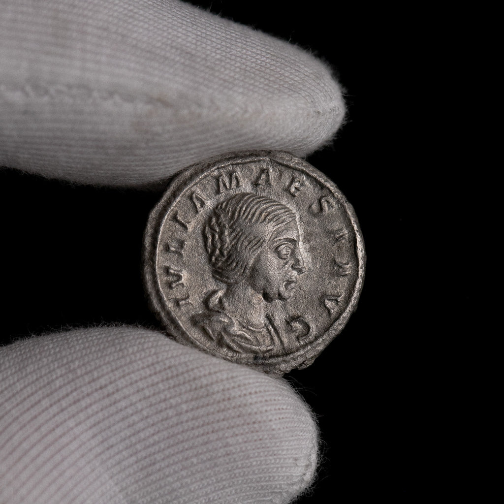 Macro detail of Roman silver denarius of Julia Maesa, portrait close-up.