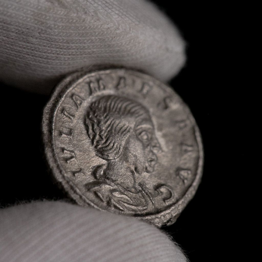 Macro detail of Roman silver denarius of Julia Maesa, portrait close-up.