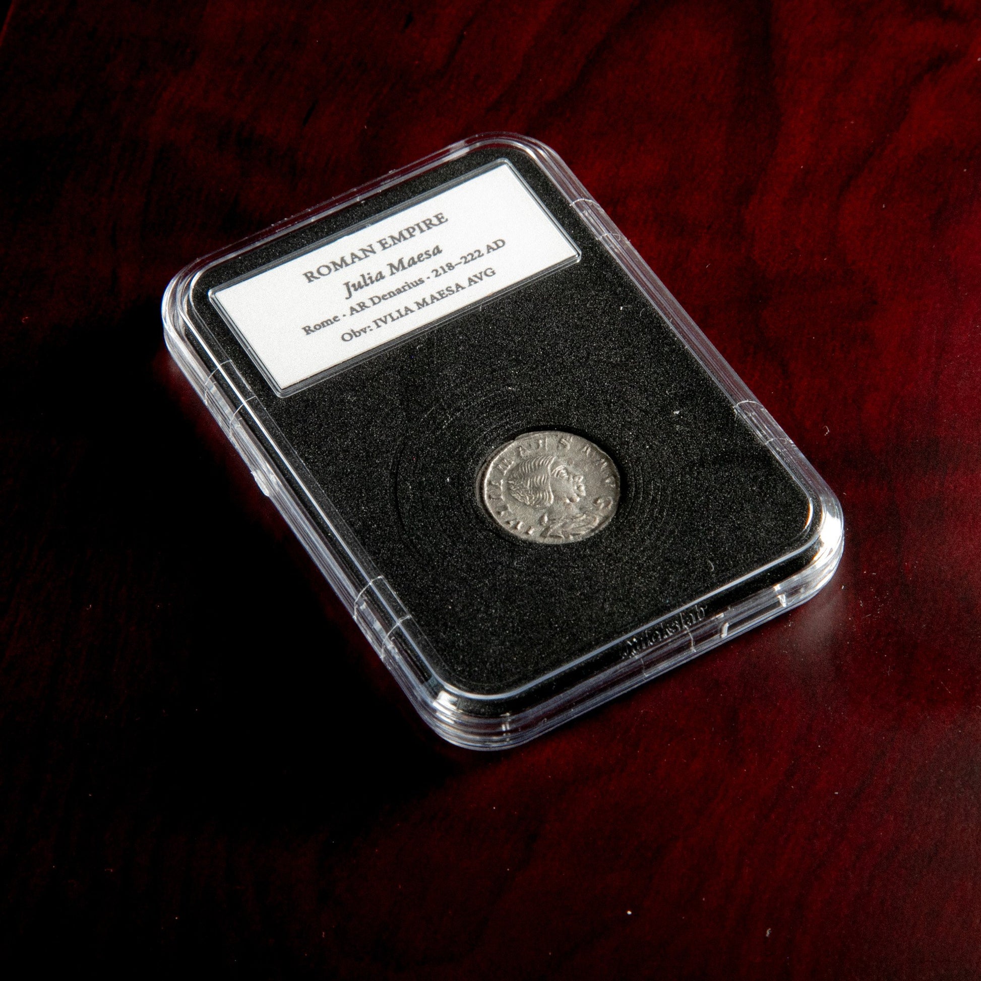 Roman silver denarius of Julia Maesa in protective slab with catalog label.