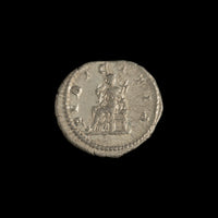 Reverse of Roman silver denarius of Julia Maesa, showing Pudicitia seated left holding scepter and drawing veil, legend PVDICITIA.
