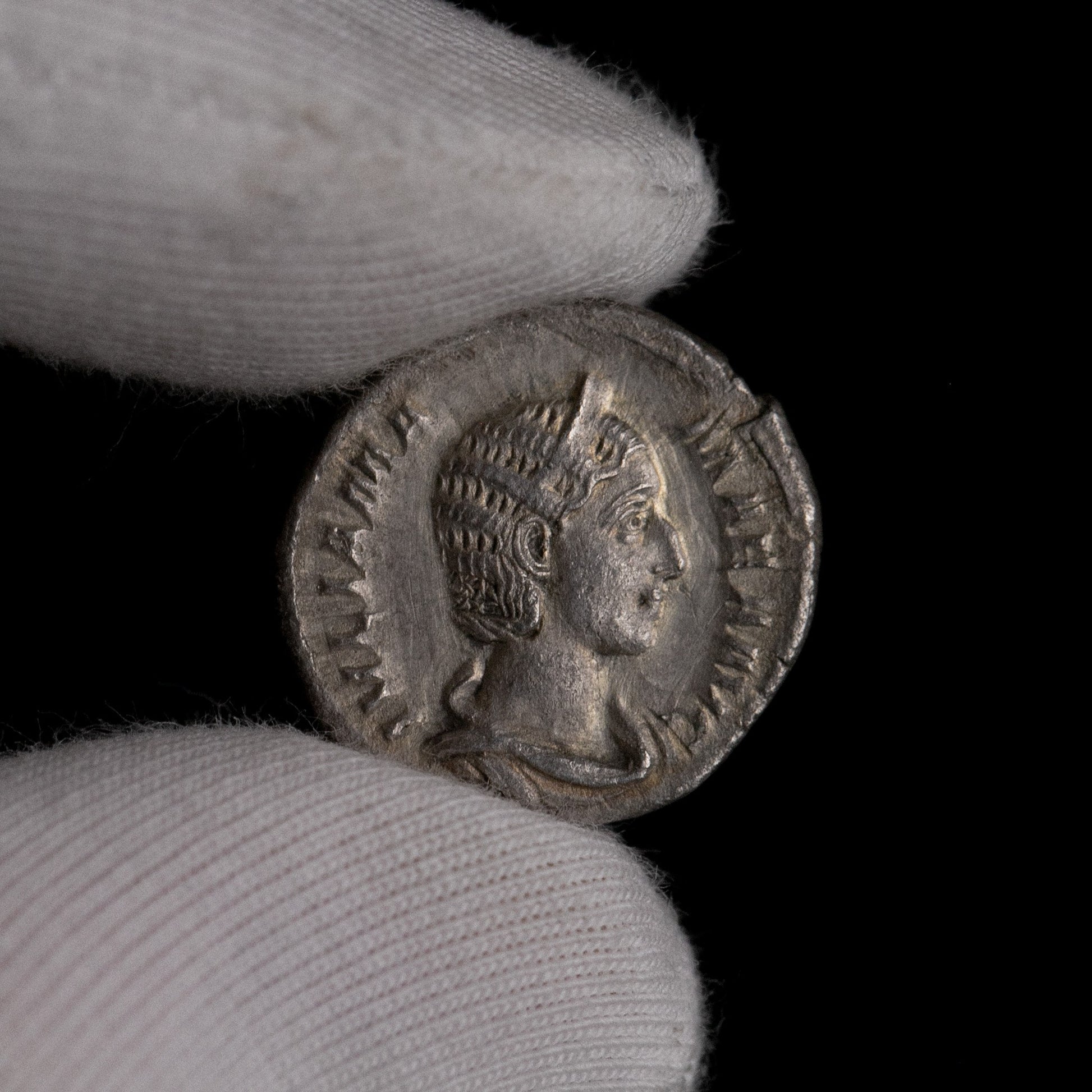 Macro detail of Roman silver denarius of Julia Mamaea, portrait close-up.
