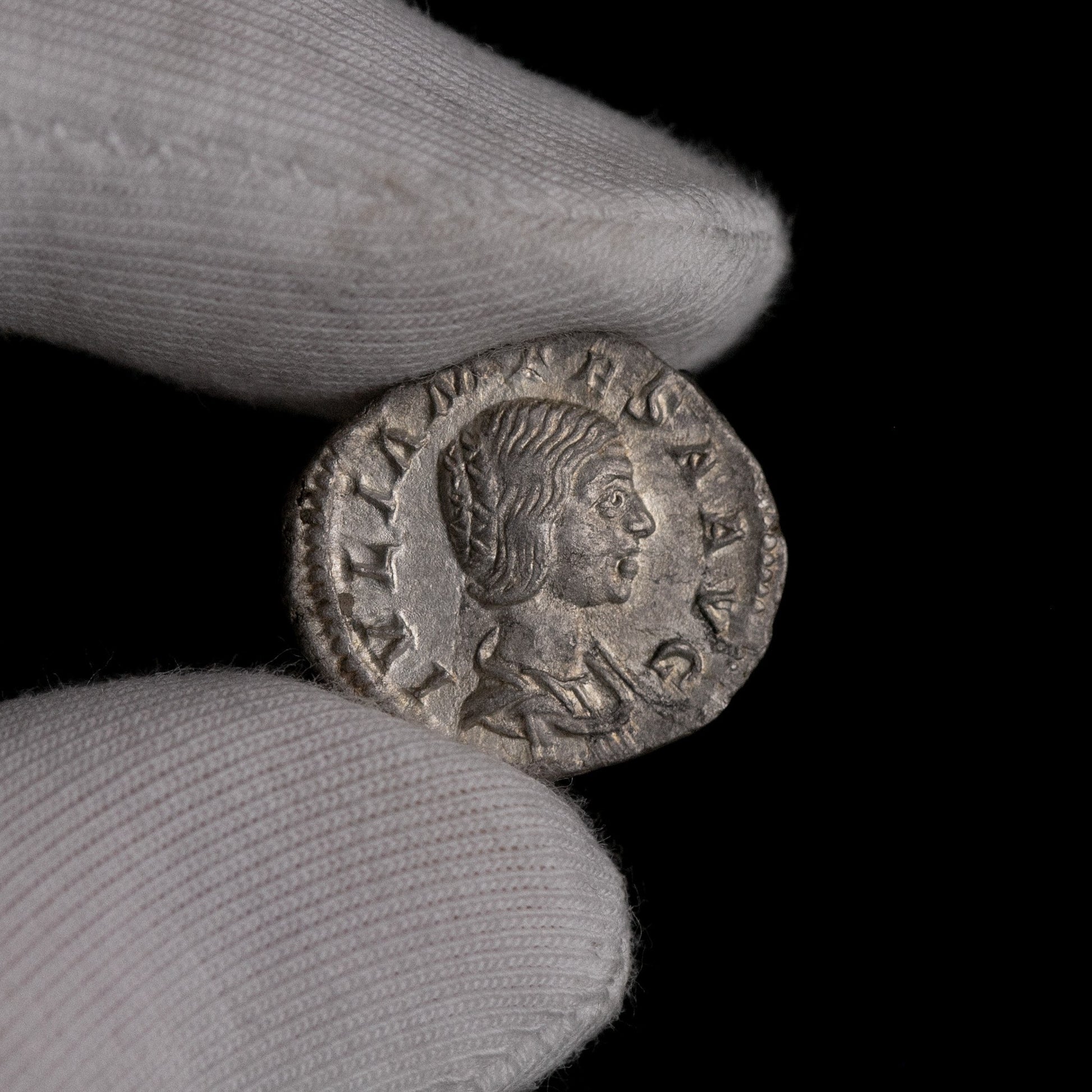 Macro detail of Roman silver denarius of Julia Mamaea, portrait close-up.