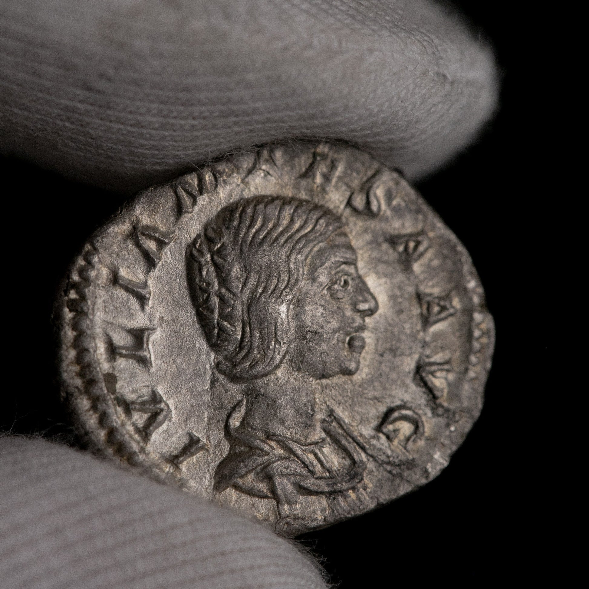 Macro detail of Roman silver denarius of Julia Mamaea, portrait close-up.