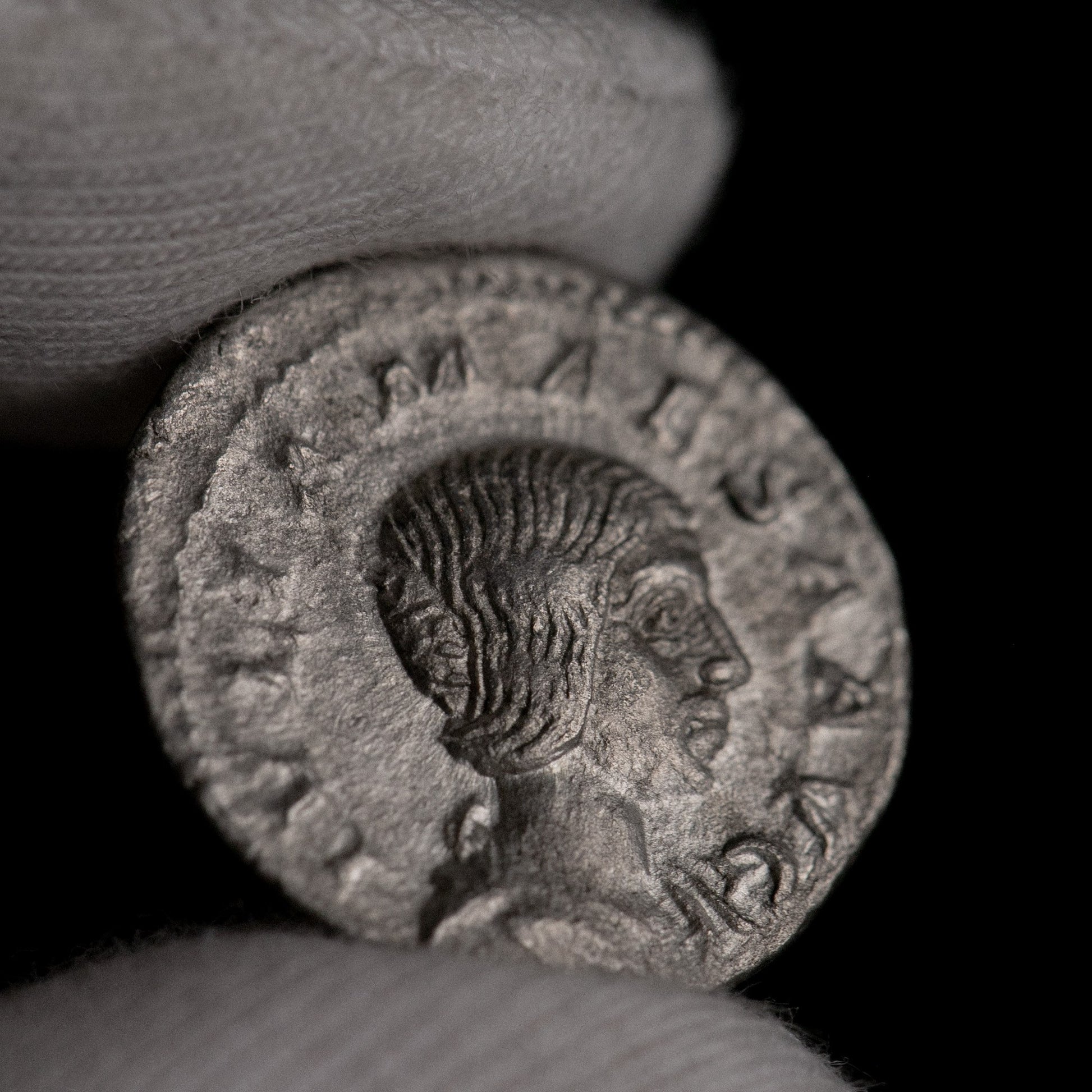 Macro detail of Roman silver denarius of Julia Mamaea, portrait close-up.