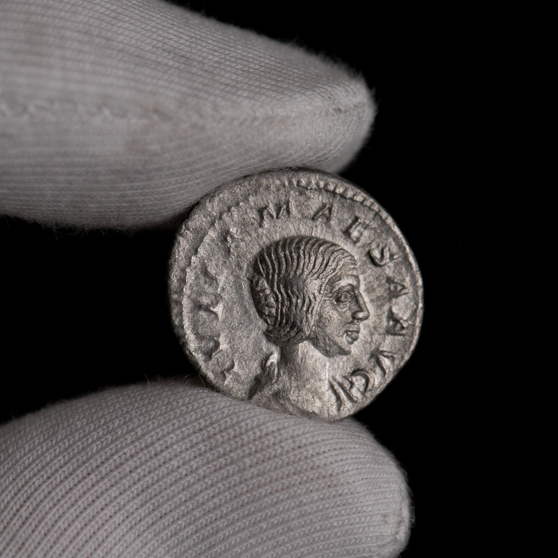 Macro detail of Roman silver denarius of Julia Mamaea, portrait close-up.