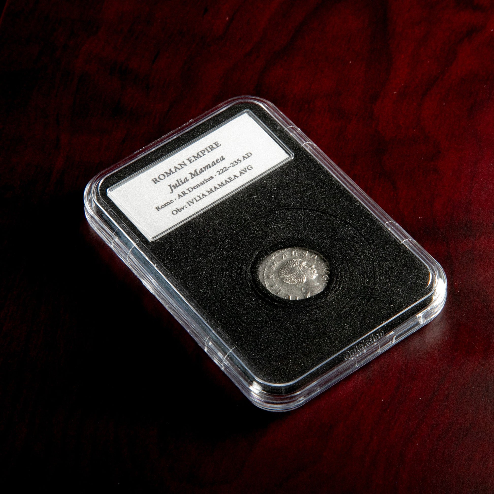 Roman silver denarius of Julia Mamaea in protective slab with catalog label.