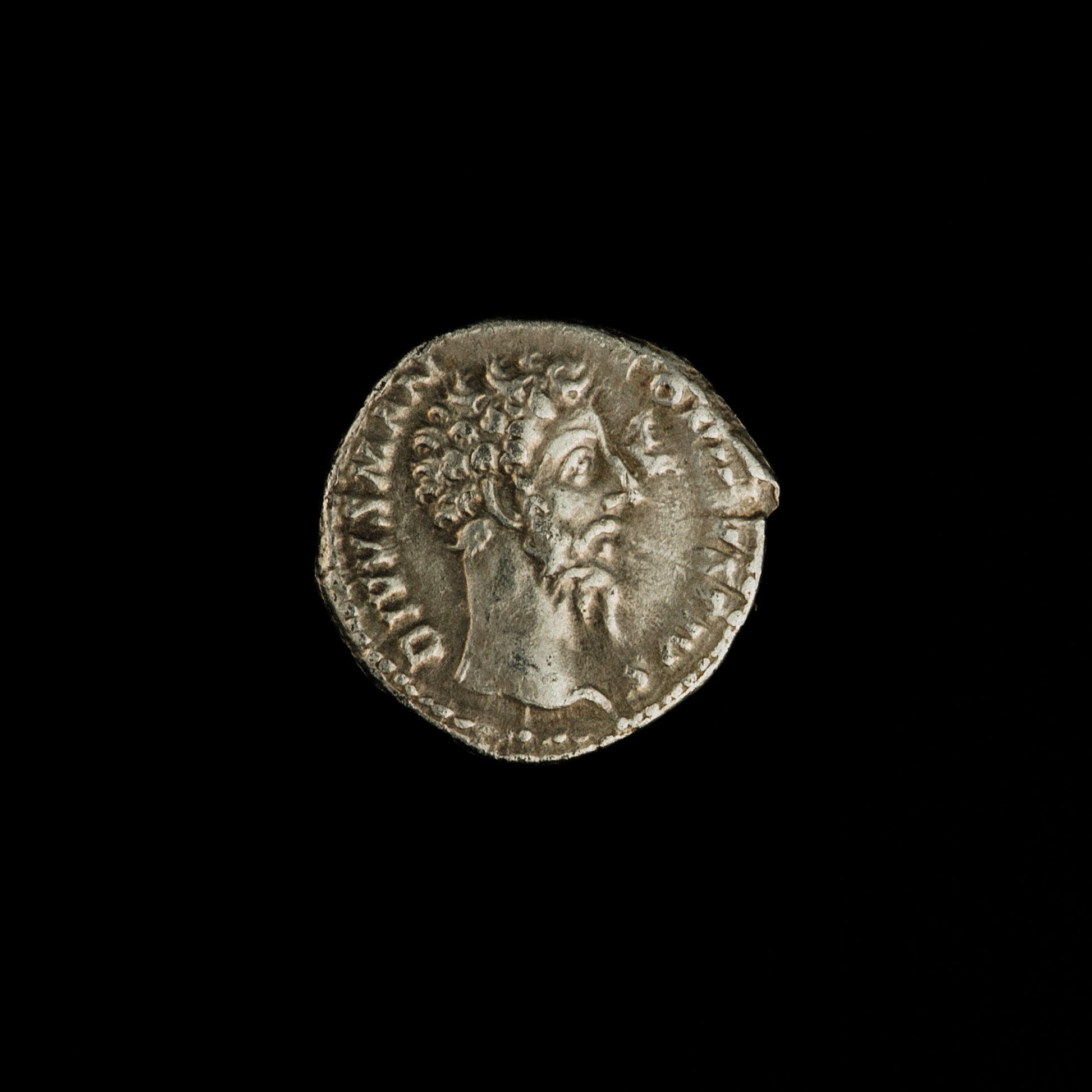 Obverse of Roman silver denarius of Divus Marcus Aurelius (under Commodus), legend DIVVS M ANTONINVS PIVS, radiate or laureate bust right.