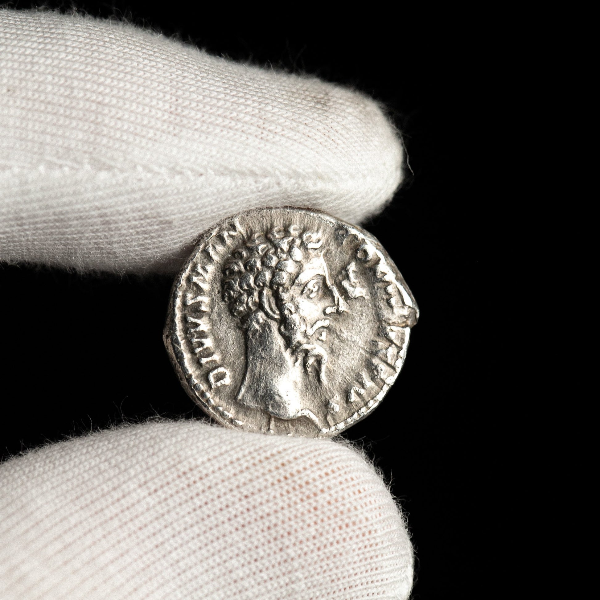 Obverse of Roman silver denarius of Divus Marcus Aurelius (under Commodus), legend DIVVS M ANTONINVS PIVS, radiate or laureate bust right.