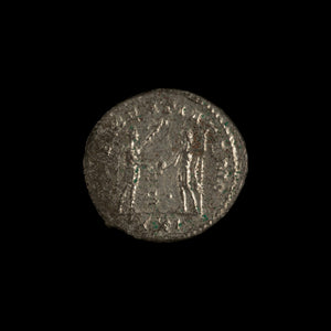 Reverse of Roman silver antoninianus of Probus, showing Probus standing right, legend CLEMENTIA TEMP.