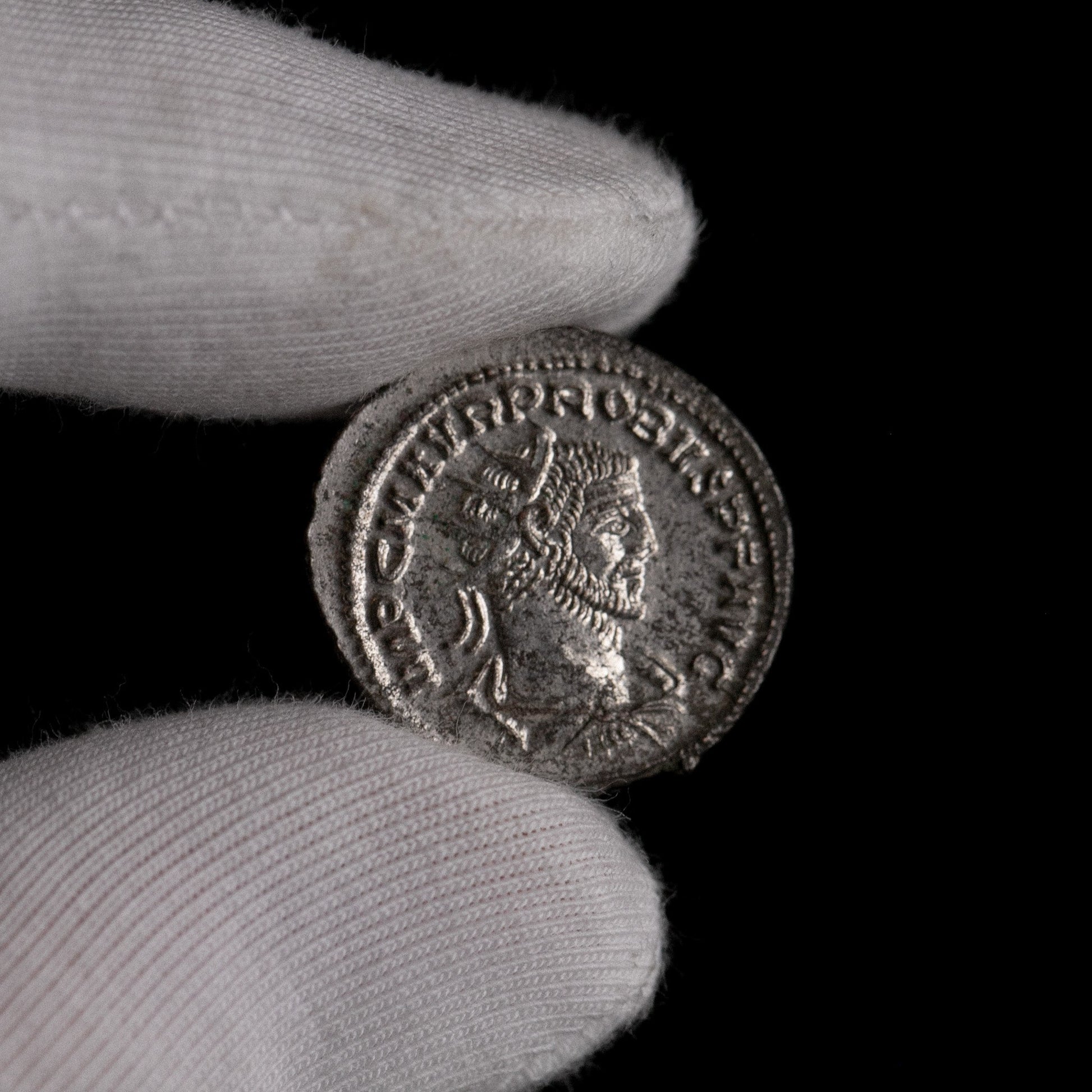 Macro detail of Roman silver antoninianus of Probus, portrait close-up.