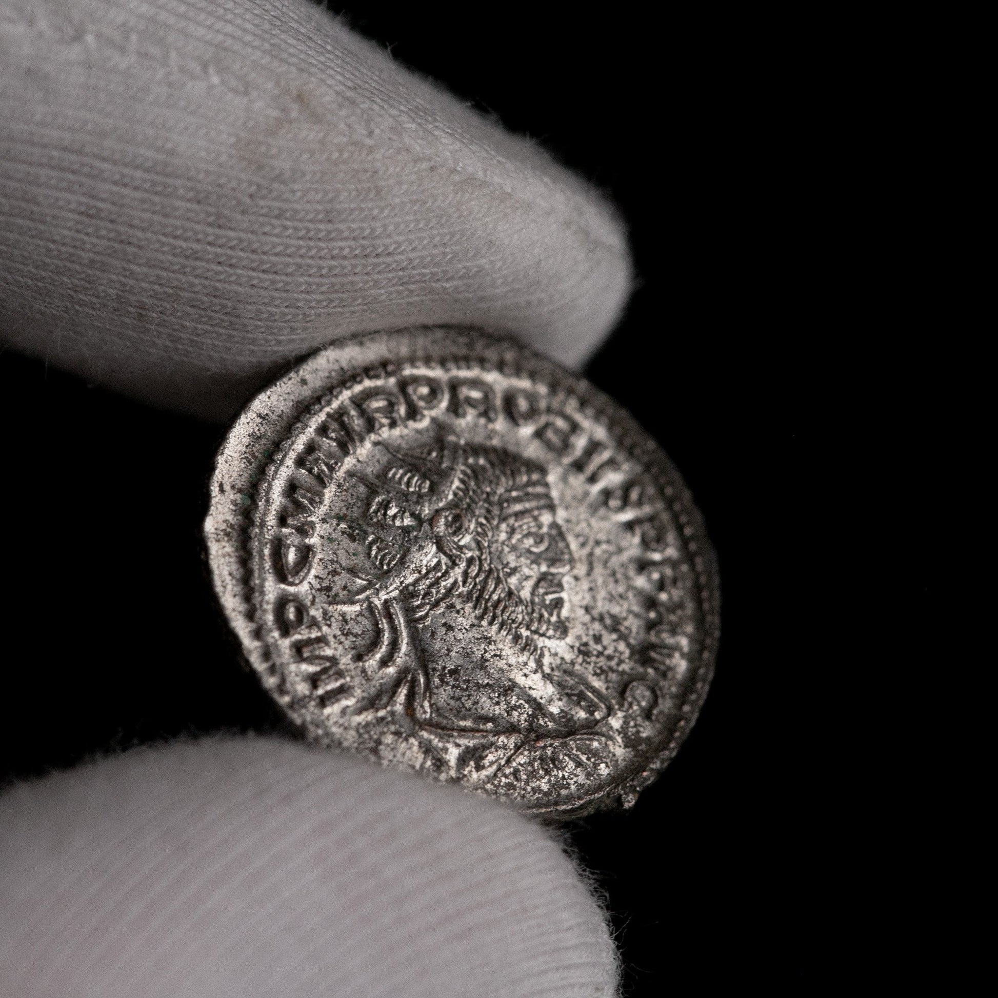 Macro detail of Roman silver antoninianus of Probus, portrait close-up.