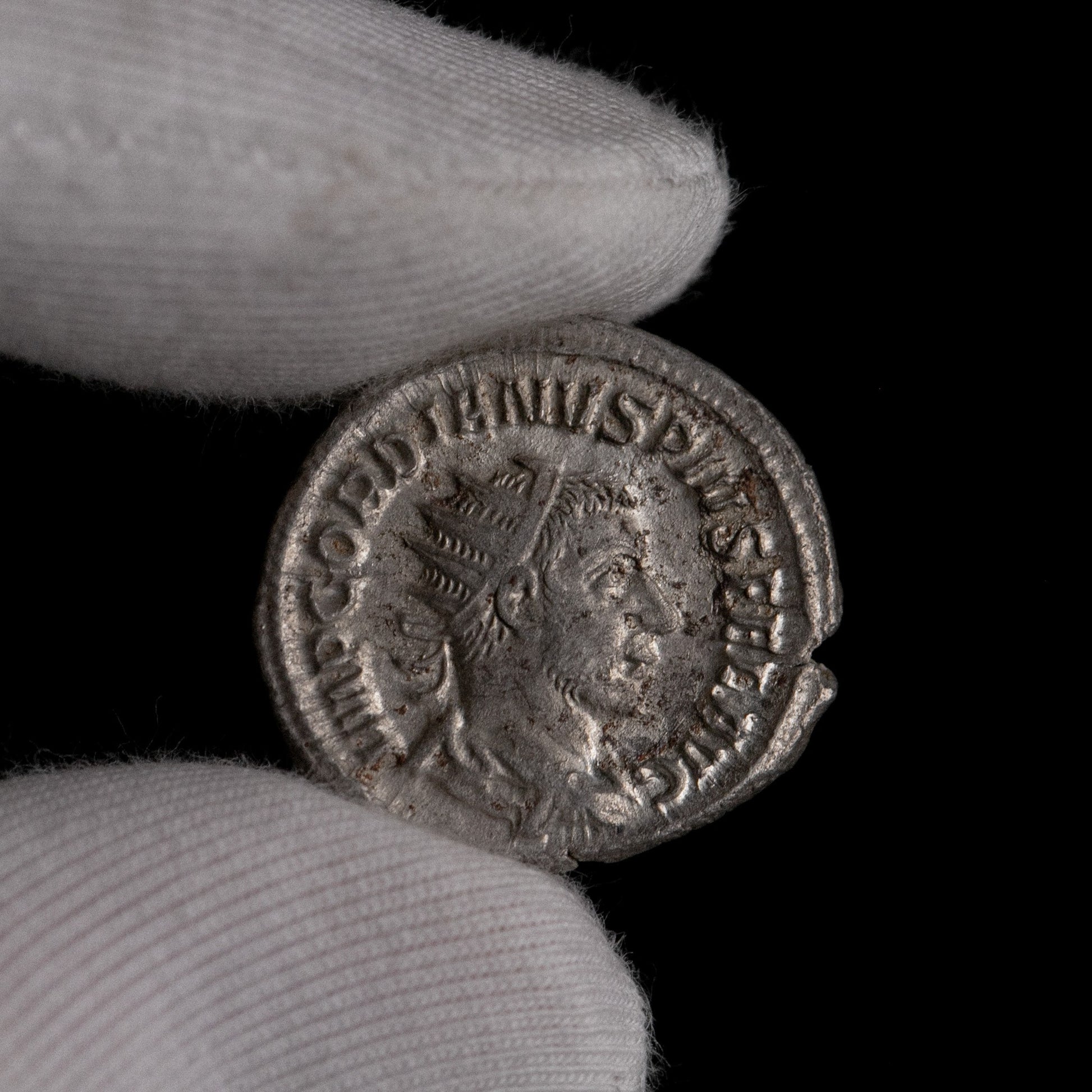 Macro detail of Roman silver antoninianus of Gordian III, portrait close-up.
