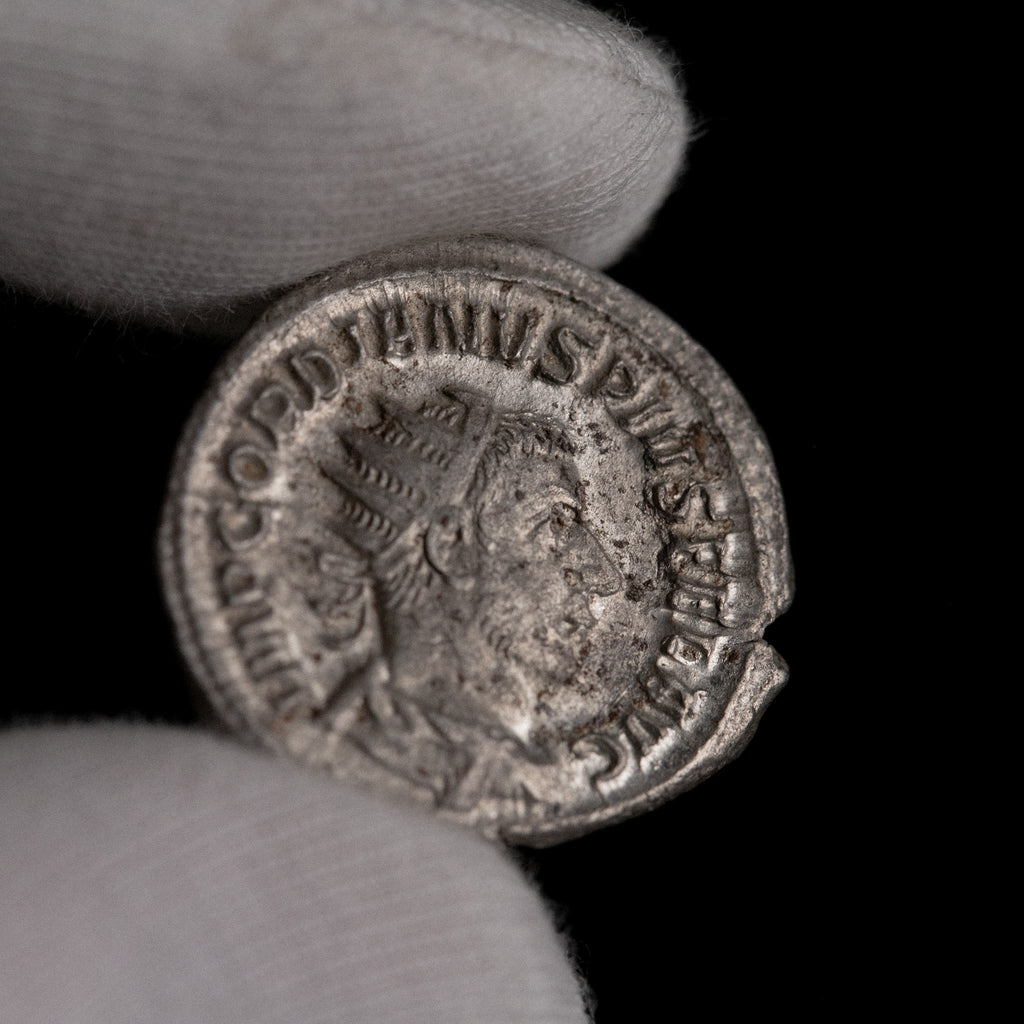 Macro detail of Roman silver antoninianus of Gordian III, portrait close-up.
