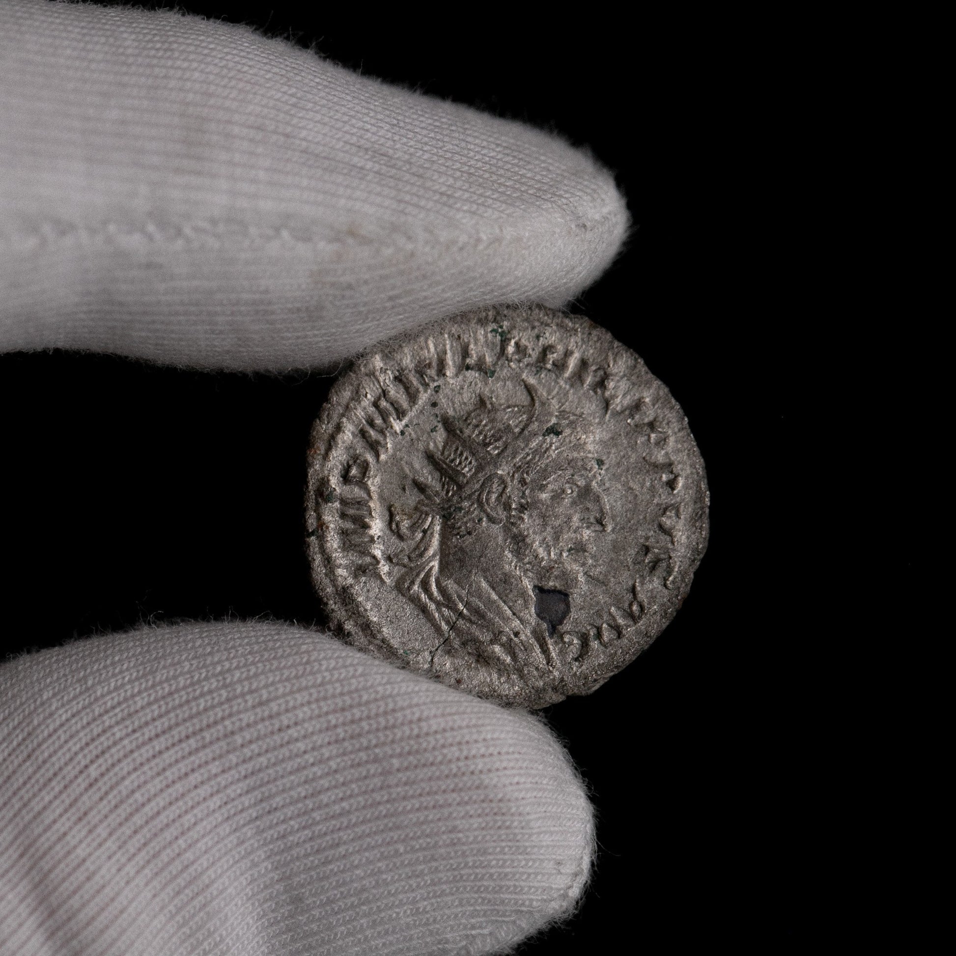 Macro detail of Roman silver antoninianus of Philip II, portrait close-up.