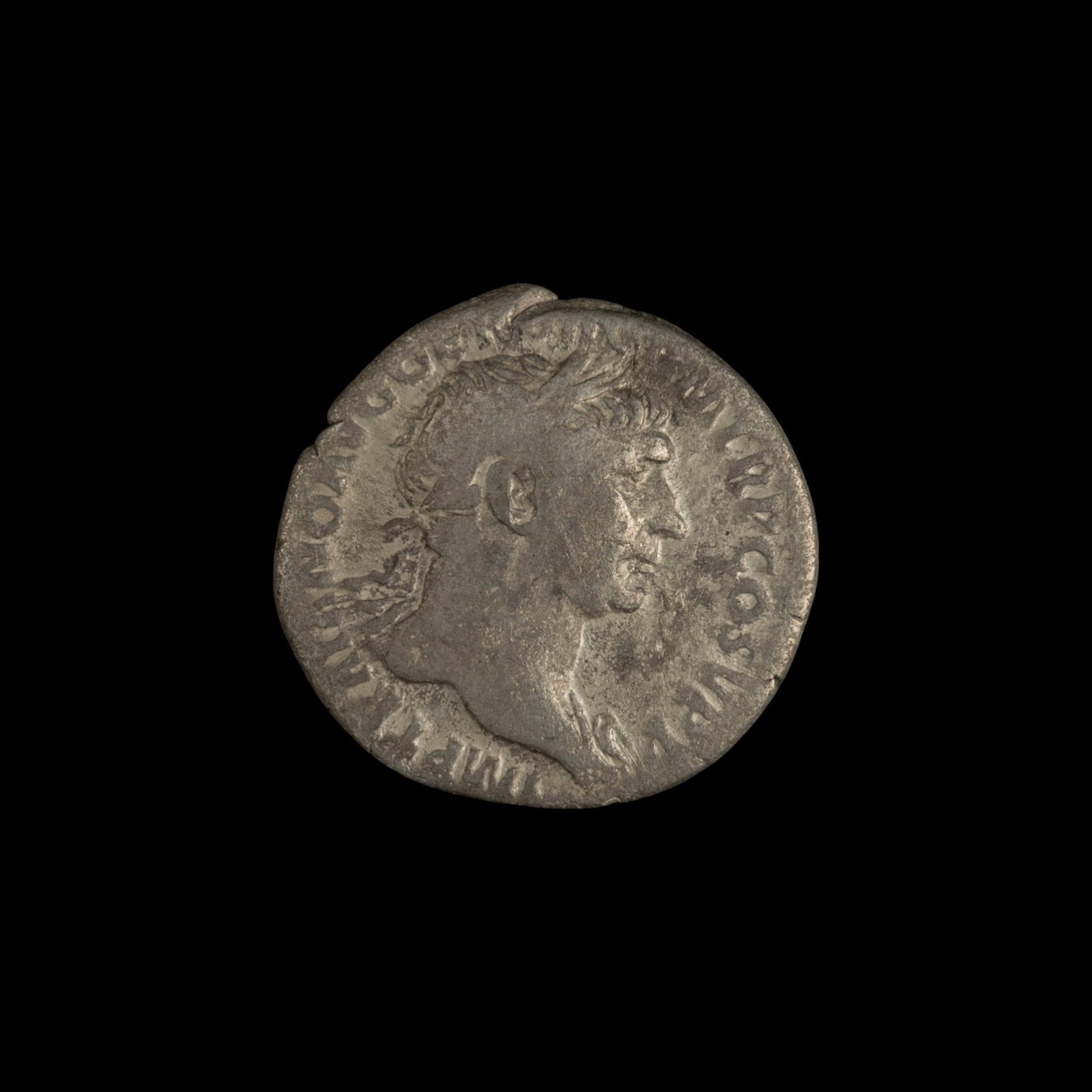 Obverse of Roman silver denarius of Trajan, legend MP TRAIANO AVG GER DAC P M TR P COS V P P, radiate or laureate bust right.