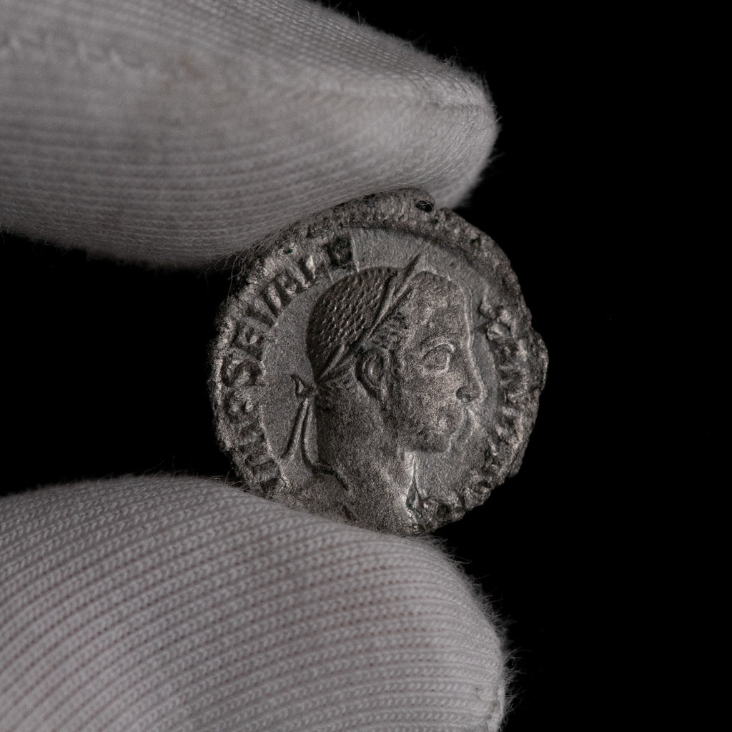 Macro detail of Roman silver denarius of Severus Alexander, portrait close-up.