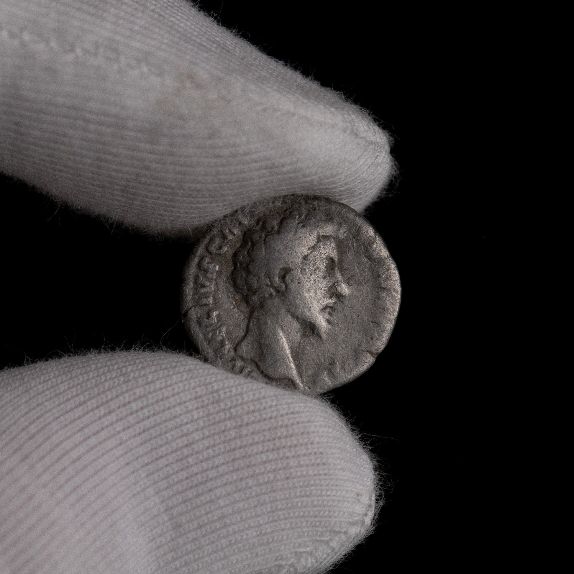 Macro detail of Roman silver denarius of Marcus Aurelius (Caesar), portrait close-up.