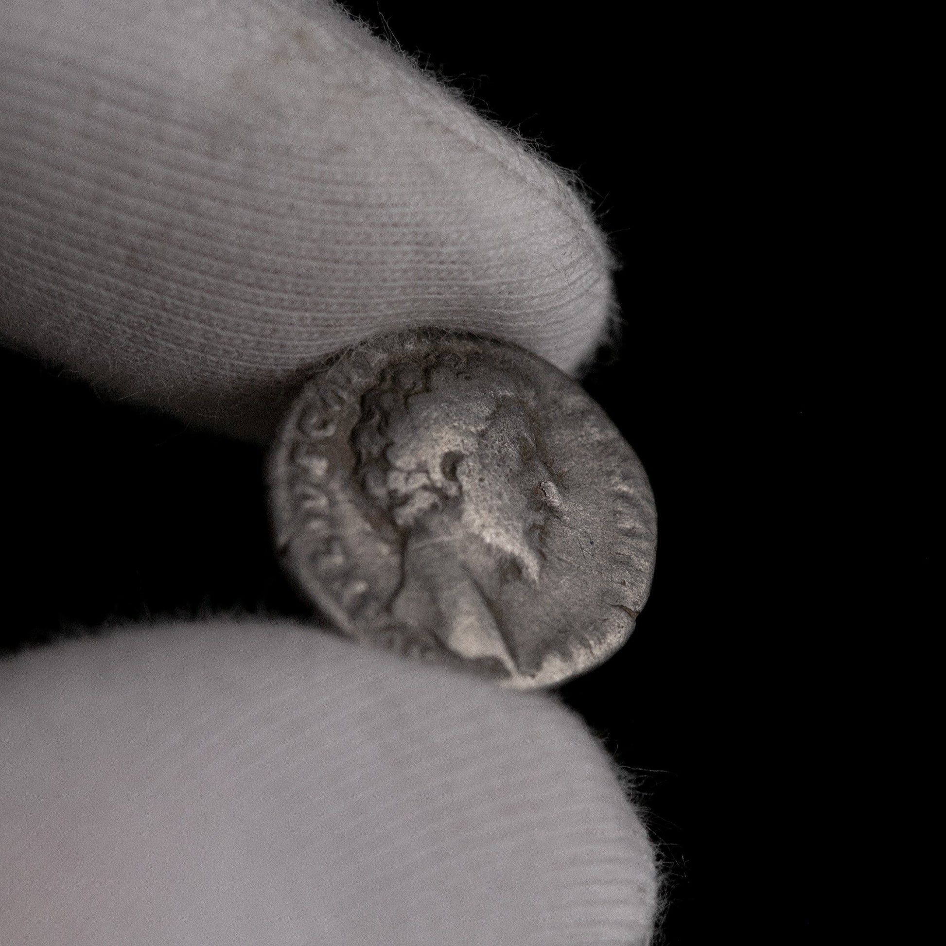 Macro detail of Roman silver denarius of Marcus Aurelius (Caesar), portrait close-up.