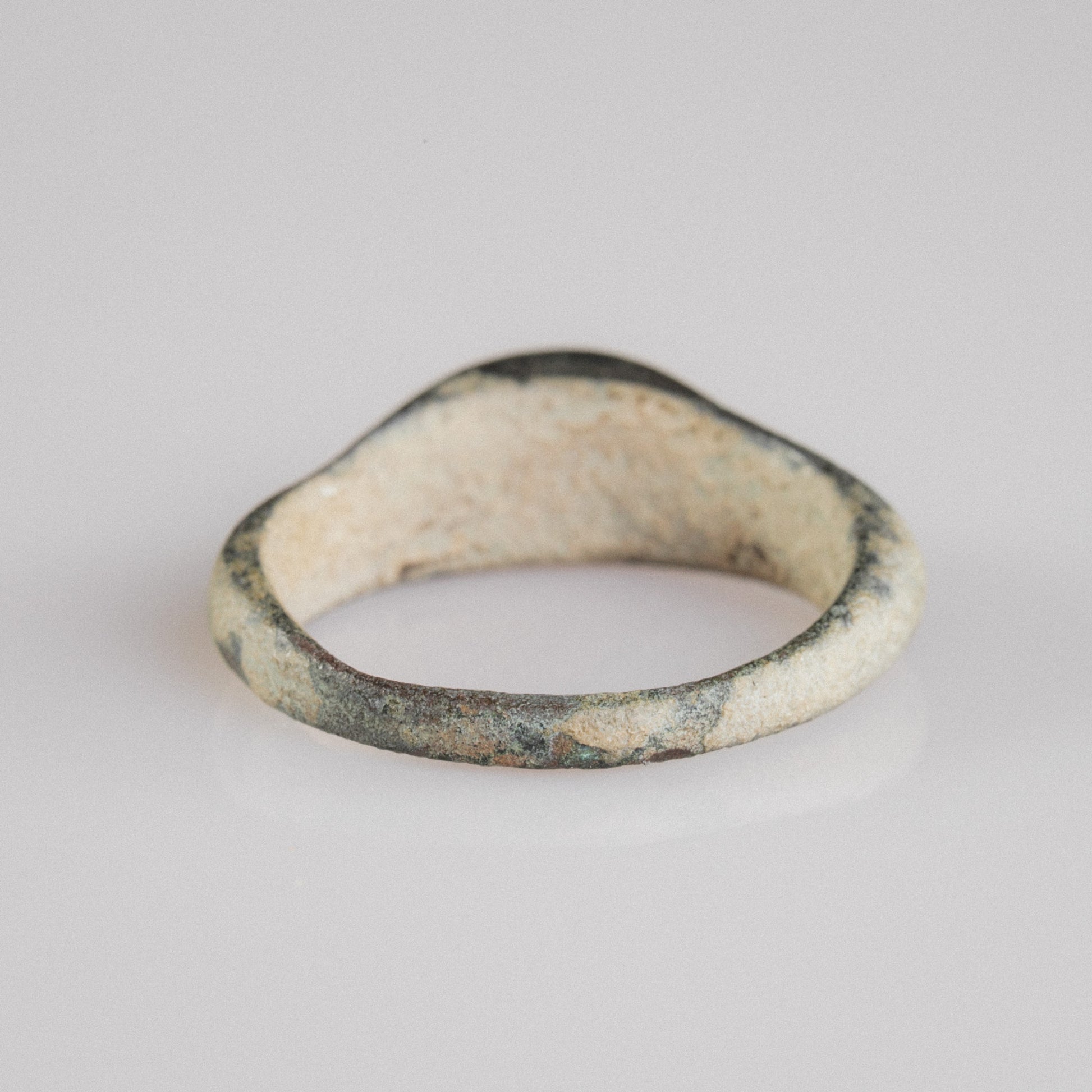 Roman bronze ring Numeria, opposite side view showing burial patina and worn bezel