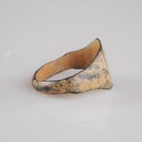 Medieval bronze signet ring Falco, side profile showing flat D-shaped hoop and narrow back