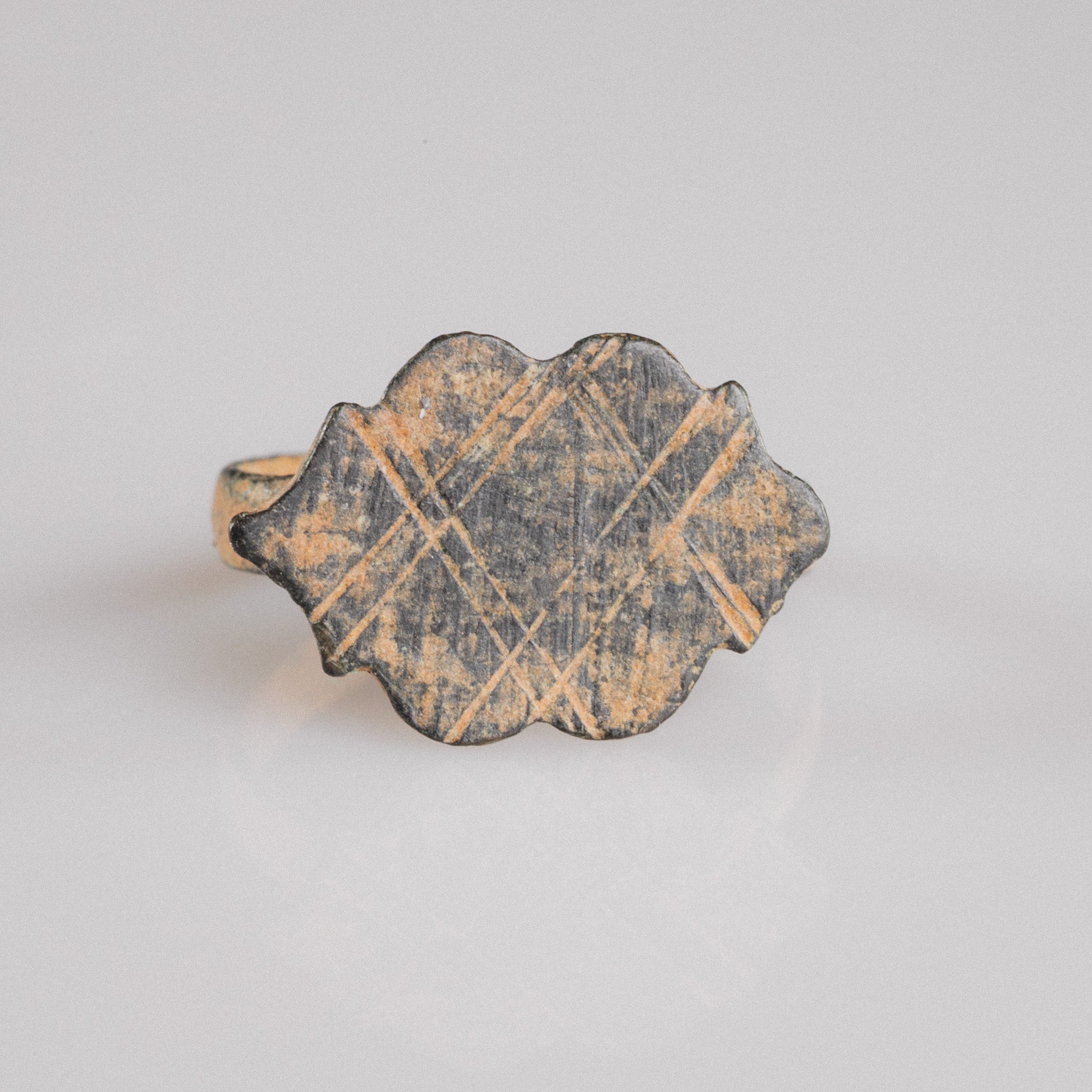 Medieval bronze ring Vladica top view showing polylobed bezel with cross-hatched diamond lattice engraving