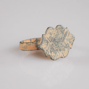 Medieval bronze ring Vladica three-quarter view revealing scalloped bezel and flared shoulders