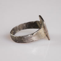 Side profile of Byzantine silver ring Theofanis revealing bezel-hoop solder junction and patina
