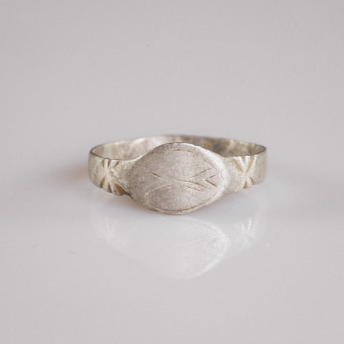 Medieval silver signet ring Aldwin with navette bezel and engraved merchant's mark, front view