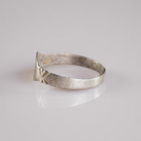 Opposite side of Medieval silver ring Aldwin with star-burst shoulder decoration