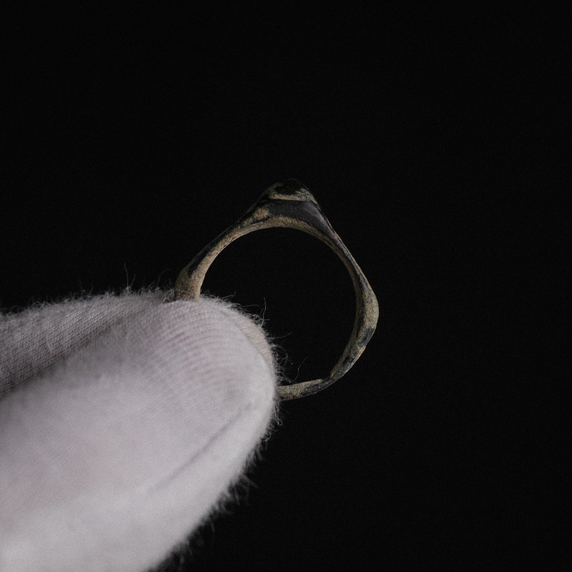 Roman bronze ring Numeria, interior hoop view revealing bronze alloy beneath patina