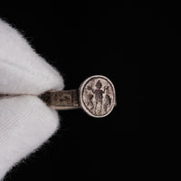 Close-up of Danielos ring bezel with central orant figure flanked by two animals