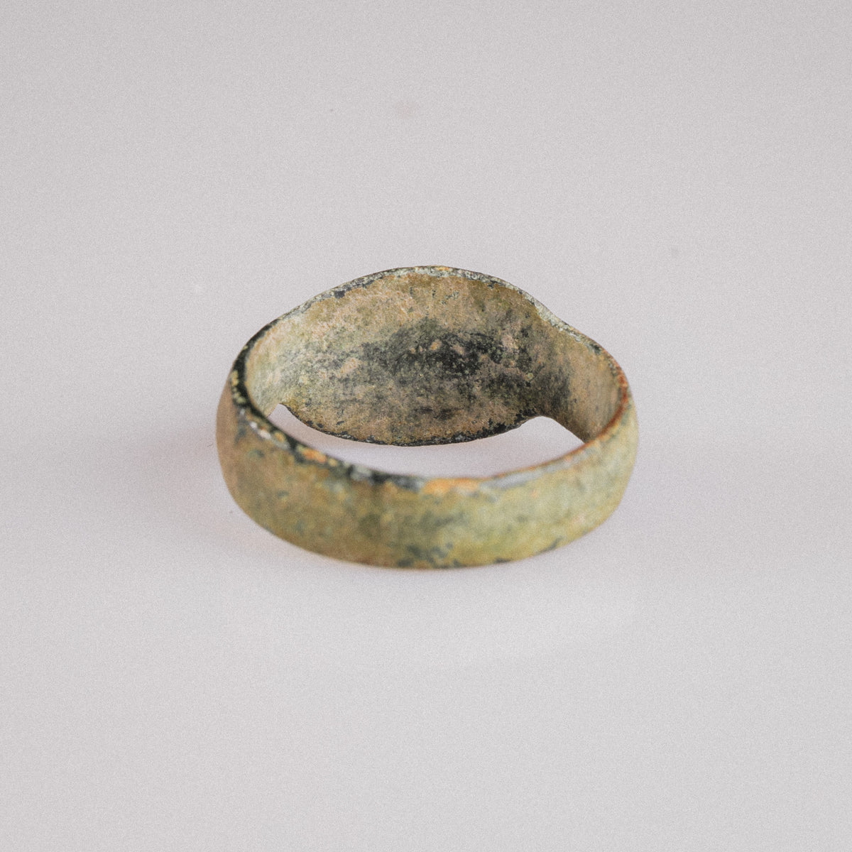Interior view of Roman bronze ring Numerius Faber revealing ancient casting texture and patina