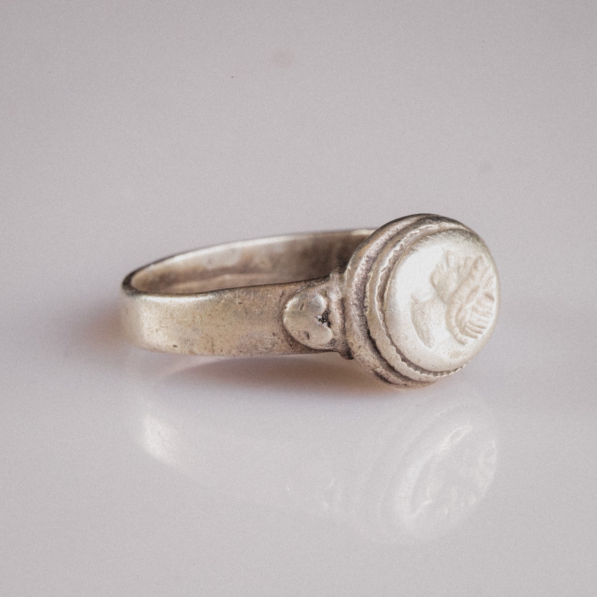 Three-quarter view of Roman silver ring Lavinia showing shoulder pellet ornaments