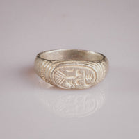 Medieval silver ring Merrick, top view of merchant's mark engraving with concentric bezel frame