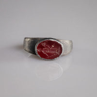 Roman silver signet ring Sereia with red garnet Isis-Fortuna intaglio, top view of bezel