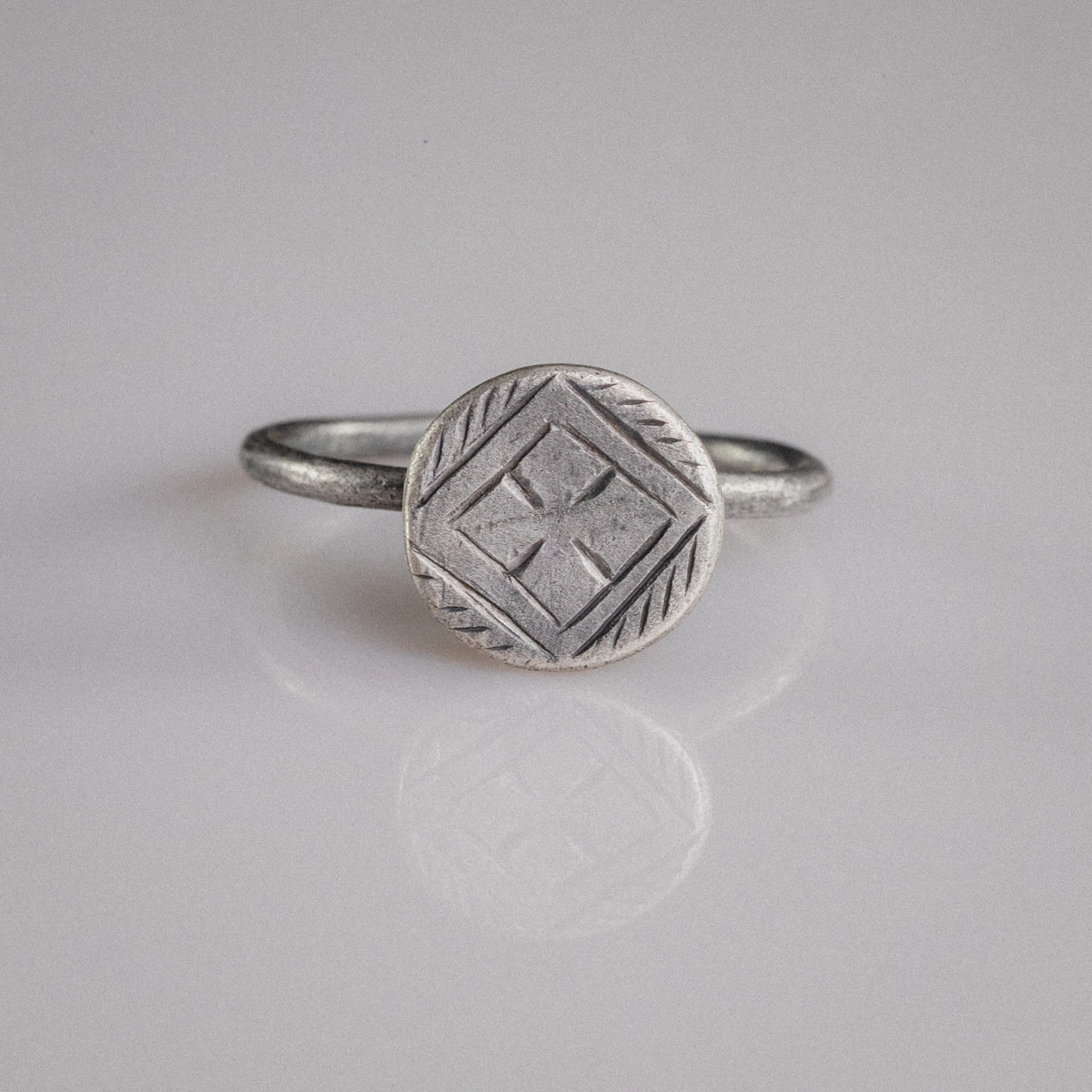 Byzantine silver ring Crucia with cross pattée in lozenge frame on disc bezel