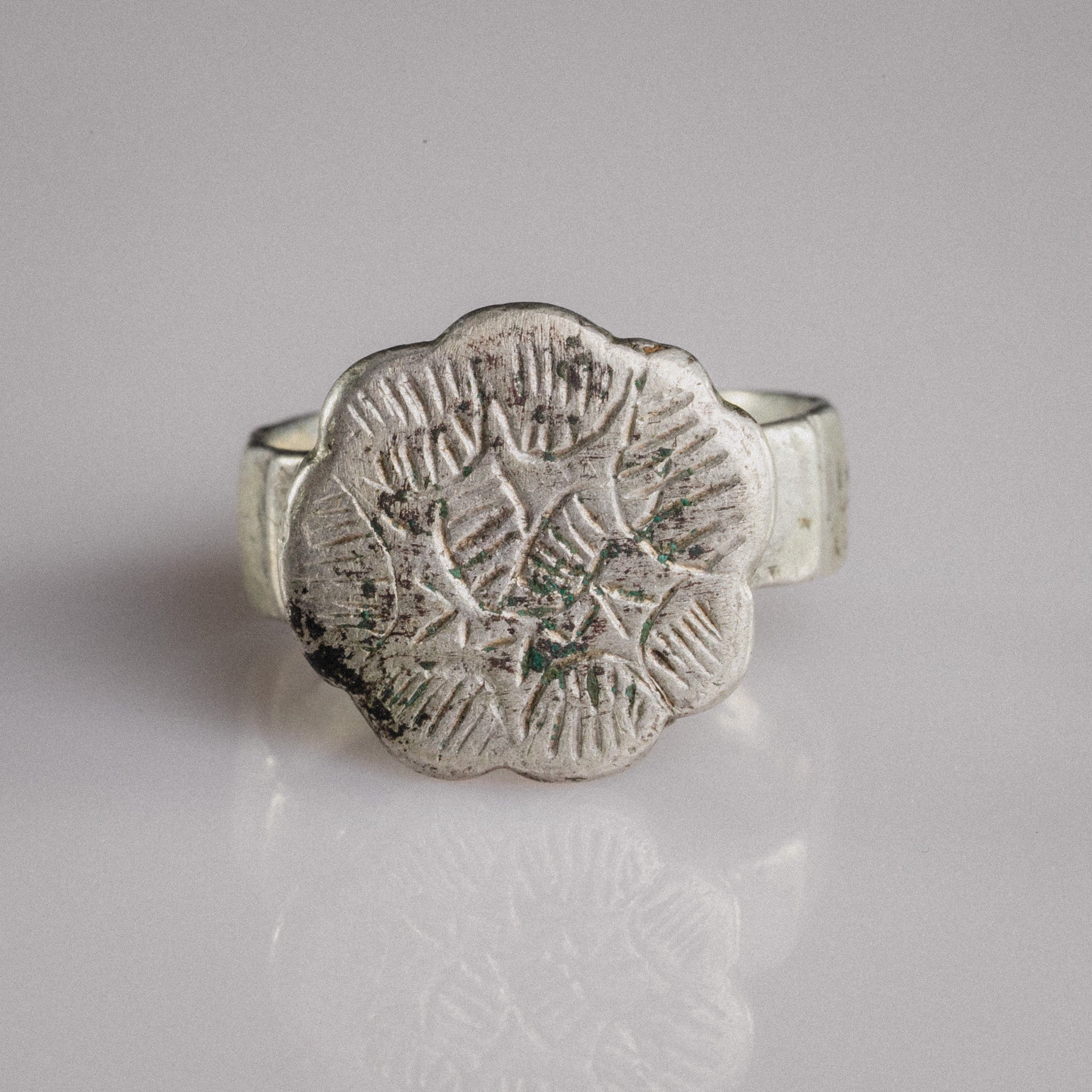 Medieval silver signet ring Florian with sexfoil bezel and engraved star rosette motif