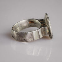 Profile of Florian medieval silver ring showing flat band and bezel construction