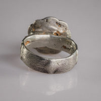 Interior view of Florian medieval signet ring revealing aged silver patina and solder join