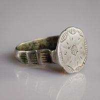 Side view of medieval silver ring Stavros showing hatched rectangular shoulder panels and D-section hoop