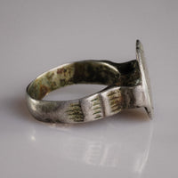 Profile of Byzantine-Balkan silver ring Stavros revealing hoop patina and bezel construction