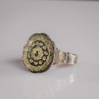 Detail of Islamic silver ring Gulizar with chased spiral rosette and scalloped sunburst border